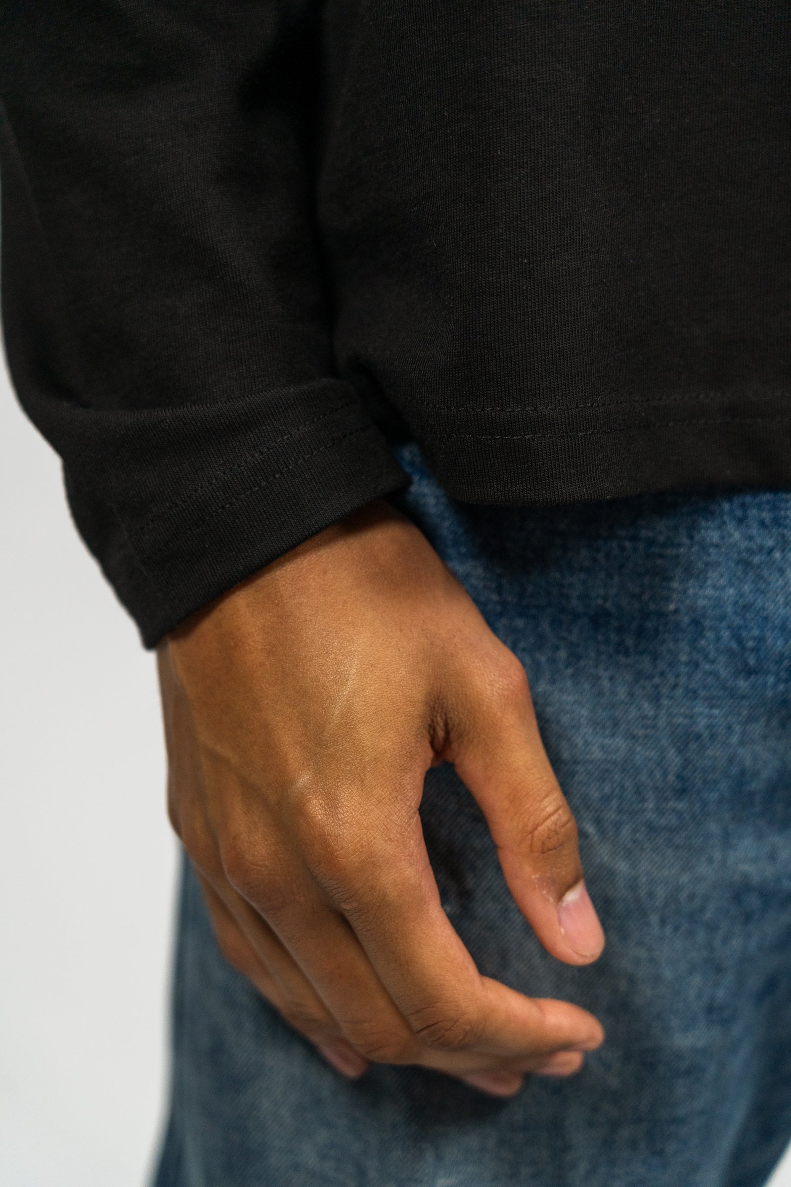 KHAIR Foundations black long sleeve cuff detail