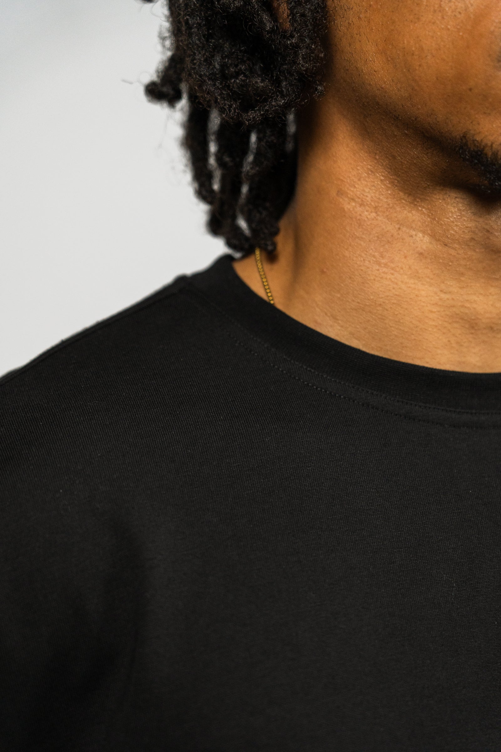 KHAIR Foundations black long sleeve neckline detail