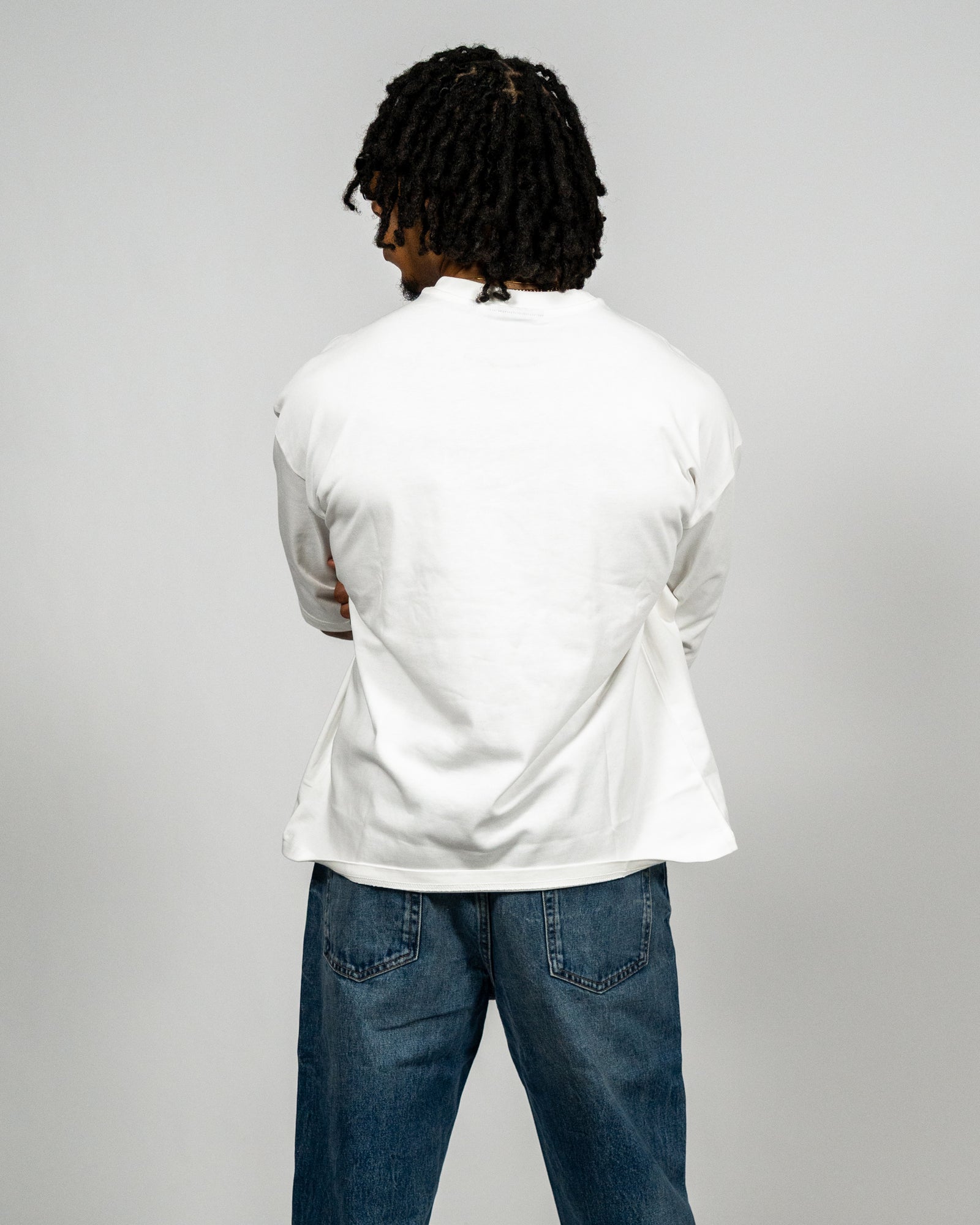 KHAIR Foundations off-white T-shirt back fit on model