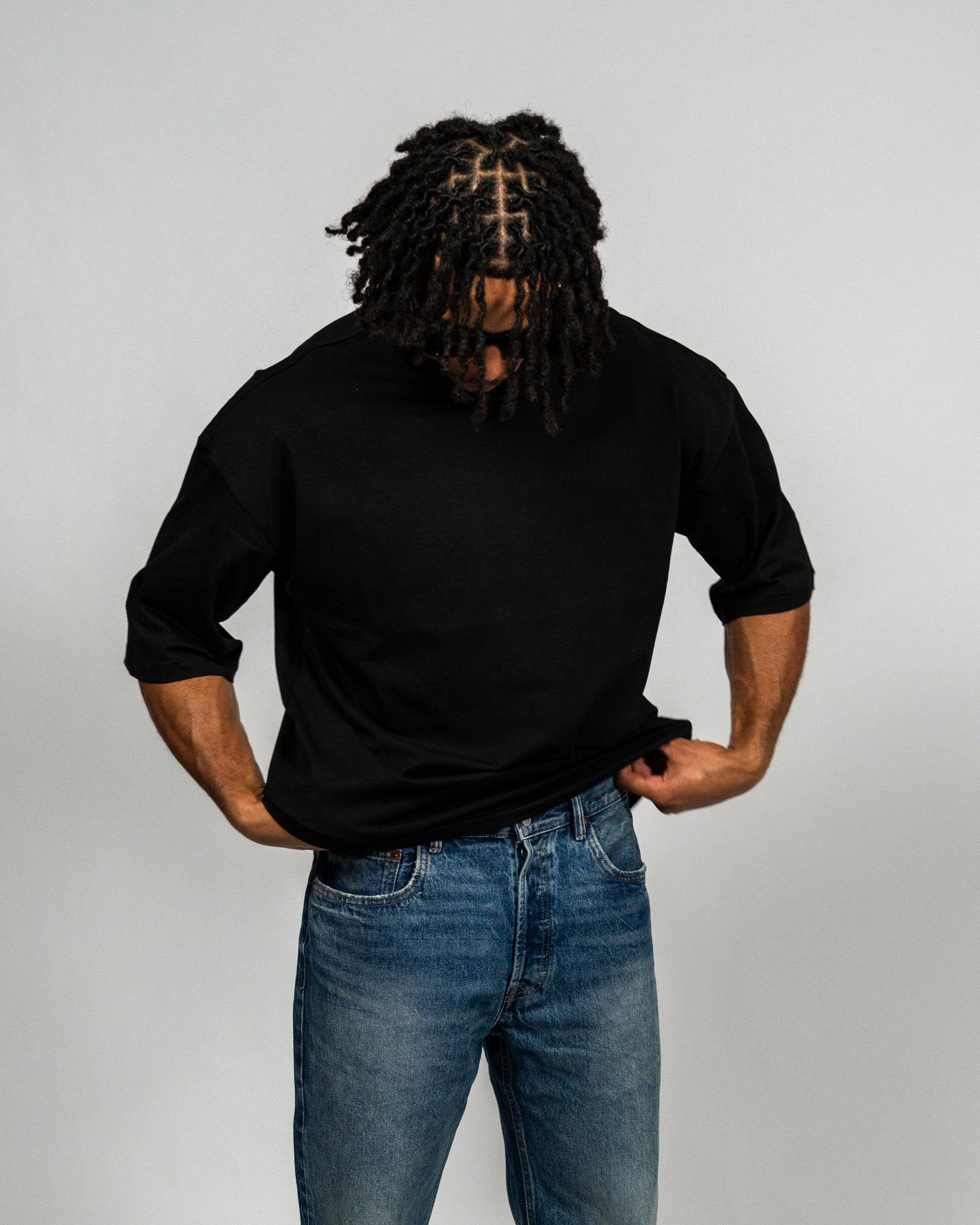 KHAIR Foundations black T-shirt drape and sleeve detail