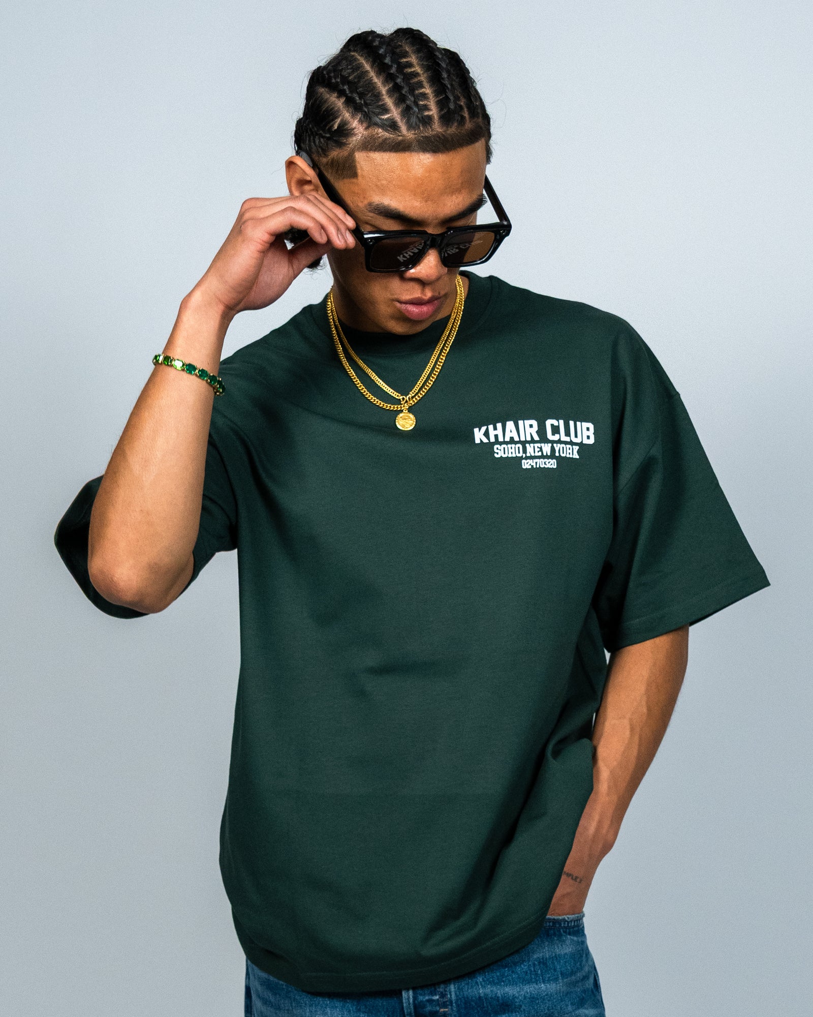 KHAIR CLUB Soho forest green T-shirt chest print close-up