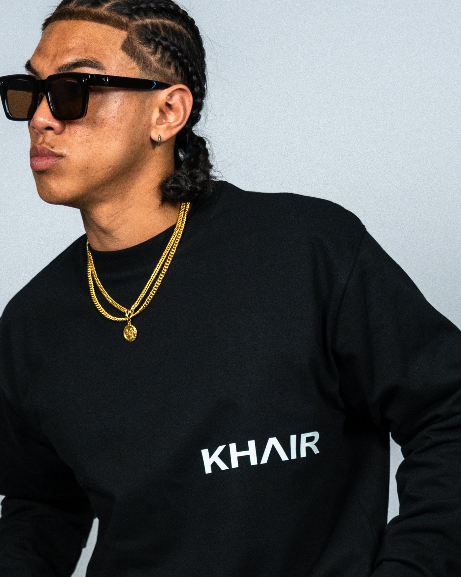 KHAIR Signature black long sleeve chest logo close-up