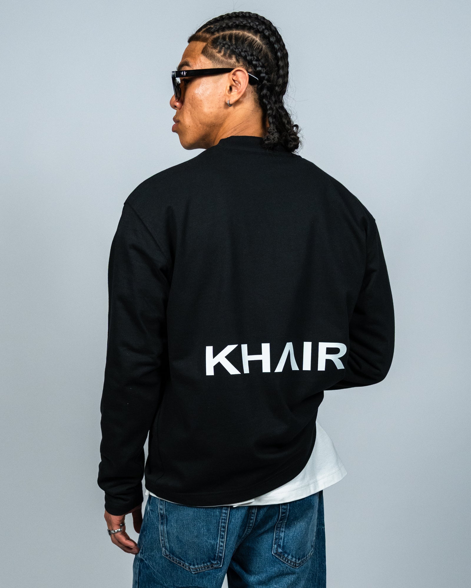 KHAIR Signature black long sleeve back logo close-up