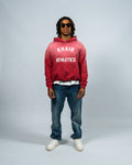 KHAIR Athletics vintage red hoodie full front fit on model product view