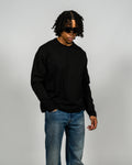 KHAIR Foundations black long sleeve three-quarter front fit product view