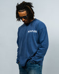 Model wearing the KHAIR Signature washed-blue oversized long sleeve product view
