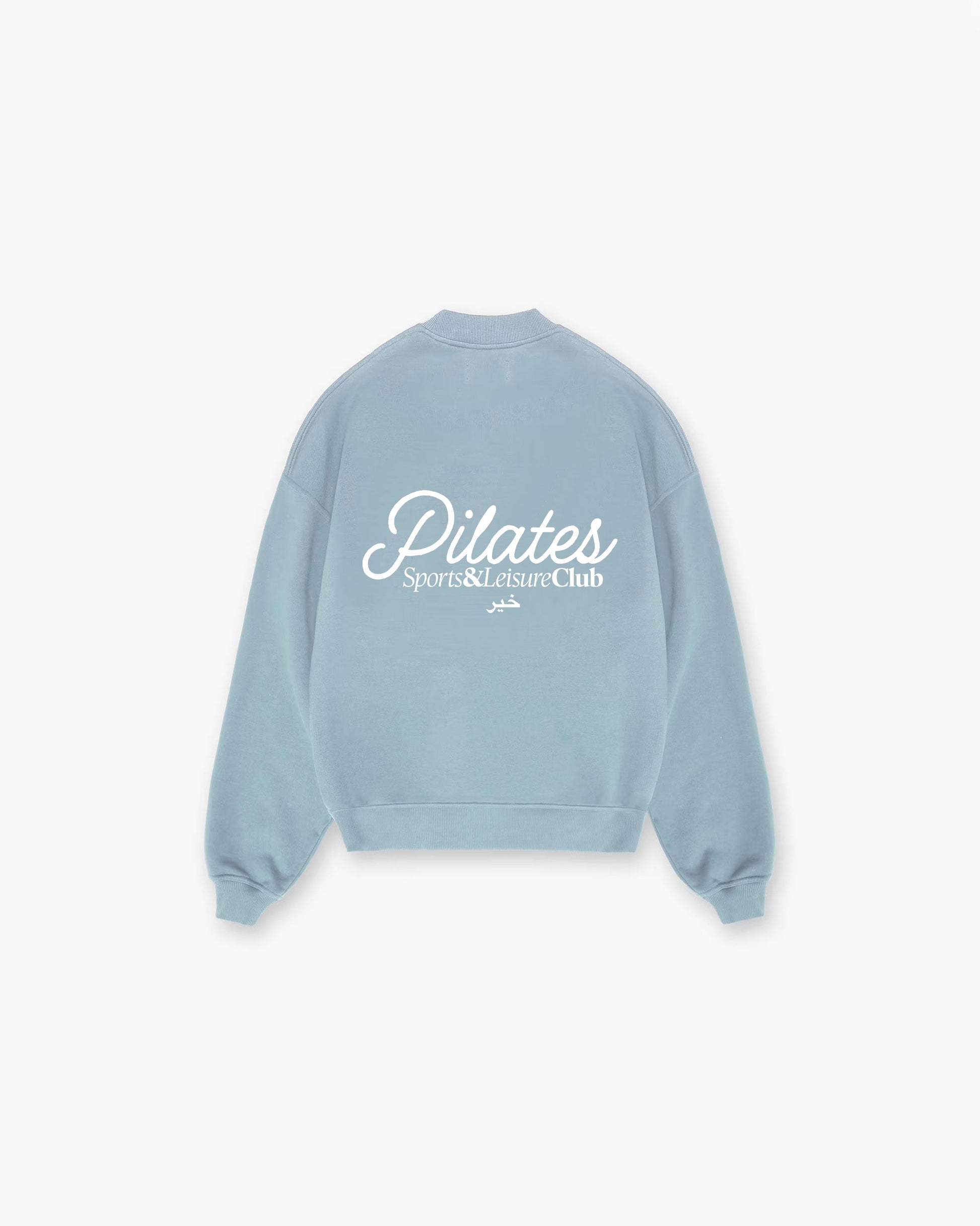 Oversized powder blue crewneck with large white Pilates Sports & Leisure Club logo on back, heavyweight cotton sweatshirt.